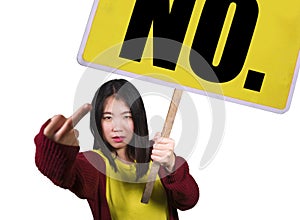 Beautiful and angry Asian woman holding protest billboard with the word No protesting in human rights and freedom defense and