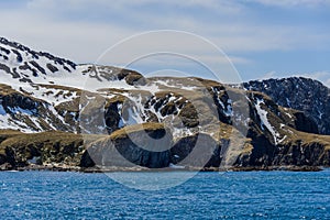 Beautiful antarctic landscape with iceberg and mountains