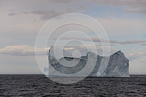 Beautiful antarctic landscape with iceberg and mountains