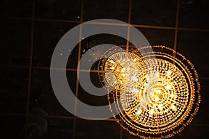 Beautiful antique design crystal chandelier ceiling lamp lighting in glass cathedral of Wat Chantaram or Tha Sung Crystal Temple