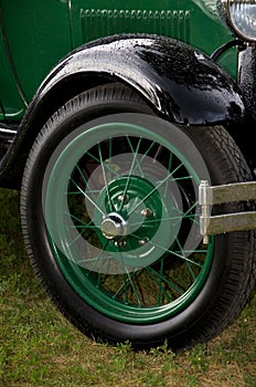 Beautiful Antique Green Car Spoke Wheel and Fender