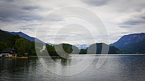 Beautiful Aps landscape with lake,  green mountains, valley, forest and church on the Coast photo