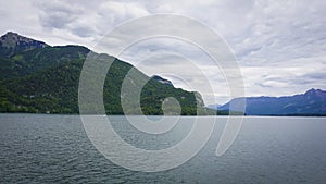 Beautiful Aps landscape withbig lake surrounded by green mountains photo