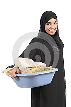 Beautiful arab woman carrying laundry