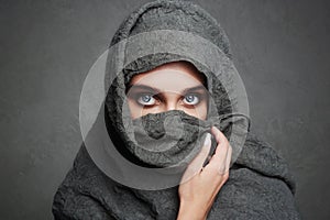 Beautiful arab woman covers her face