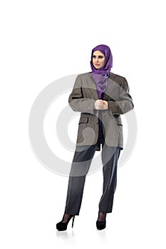 Beautiful arab woman posing in stylish office attire isolated on studio background. Fashion concept