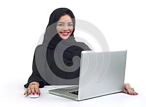 Beautiful Arabian business woman working on her laptop