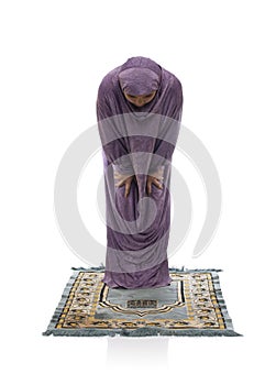 Beautiful Arabic Girl Praying Wearing Muslim Clothes, Bowing