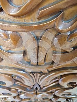 Beautiful Arabic pattern carved from the wood on the door of the mosque. Eastern architectural design.
