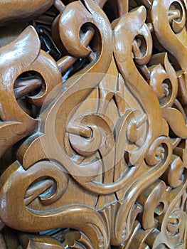 Beautiful Arabic pattern carved from the wood on the door of the mosque. Eastern architectural design.