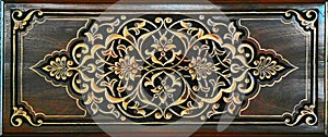 Beautiful Arabic patterns carved from wood on the door. Eastern architectural design.