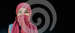 Beautiful arabic woman in red hijab with bright makeup