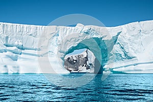 Beautiful arch shaped iceberg in Antarctica.
