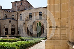 Beautiful archade and garden at San Salvador Monastery at Ona, Merindades, Burgos, Spain