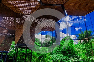 Beautiful architectural woodden structure in a botanical greenhouse in Medellin