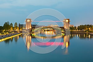 Beautiful architecture building and colorful bridge in twilight