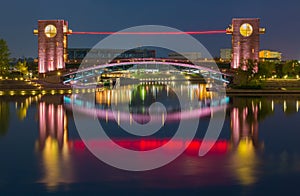 Beautiful architecture building and colorful bridge in twilight