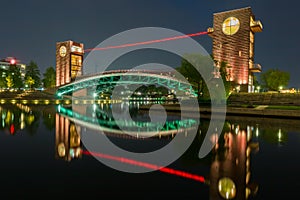 Beautiful architecture building and colorful bridge in twilight