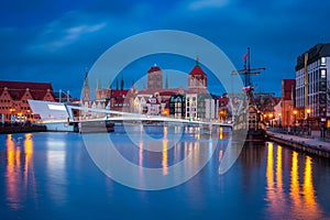 Beautiful architecture of Gdansk old town reflected in the Motlawa river at dawn, Poland