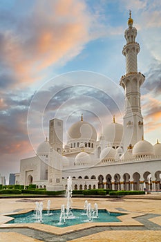 Beautiful architecture of the Grand Mosque in Abu Dhabi at sunset, United Arab Emirates