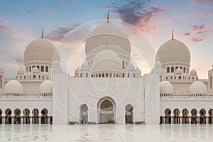 Beautiful architecture of the Grand Mosque in Abu Dhabi at sunset, United Arab Emirates