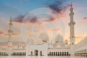 Beautiful architecture of the Grand Mosque in Abu Dhabi at sunset, United Arab Emirates