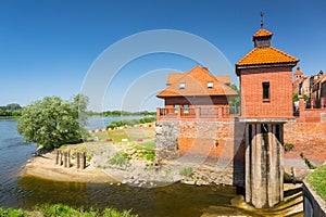 Beautiful architecture of Grudziadz with granaries at Wisla river, Poland photo