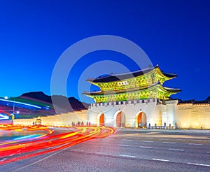 Beautiful Architecture in Gyeongbokgung Palace at Seoul city Korea at Twilight time with night light from traffic car