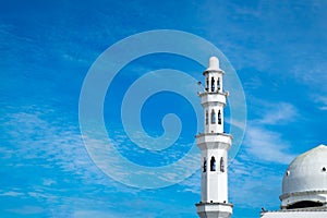 Beautiful architecture, minaret and dome of Tengku Tengah Zaharah Mosque with blue sky background