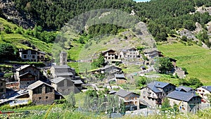 Beautiful architecture of natural stone buildings in the village of Pal on the side of the mountains. Andorra, June 29, 2019