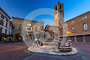 Beautiful architecture of the Piazza Vecchia in Bergamo at dawn, Italy