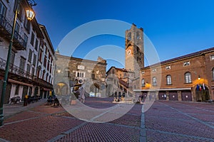 Beautiful architecture of the Piazza Vecchia in Bergamo at dawn, Italy