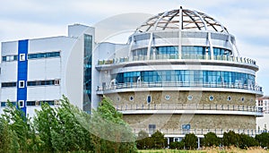 Beautiful architecture. Round building with panoramic windows. Hotel, restaurant