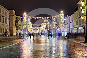 Beautiful architecture of the Royal Route with Christmas illuminations in Warsaw. Poland