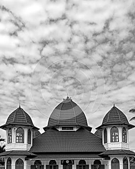 Beautiful architectures mosque under the cloudy sky
