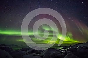 Beautiful Arctic fjord landscape with Northern Lights - Spitsbergen, Svalbard