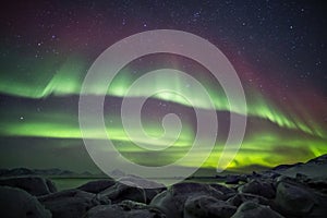 Beautiful Arctic fjord landscape with Northern Lights - Spitsbergen, Svalbard