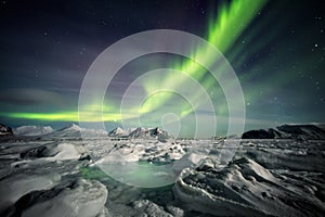 Beautiful Arctic fjord landscape with Northern Lights - Spitsbergen, Svalbard