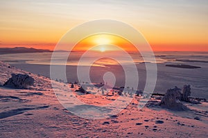 Beautiful Arctic sunset. Panoramic scenic colorful sky at dawn. Aerial view. Sunrise bright sky with White Sea. Top View from high