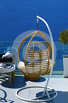 Beautiful armchairs in bamboo cane to relax with the Caldera view in Santorini