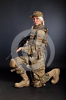 Beautiful army girl with rifle