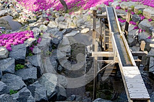 Beautiful artificial millstream or water wheel decorated in botanical garden at Hwangmaesan County Park in Hapcheon-gun.