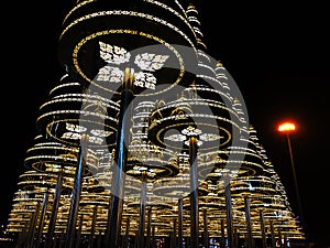 Beautiful artificial pine trees decorated with Thai pattern lights at night