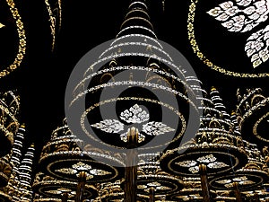 Beautiful artificial pine trees decorated with Thai pattern lights at night