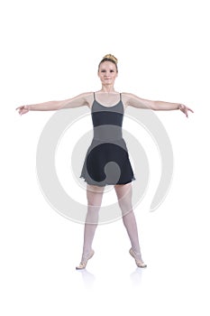 Beautiful artistic female ballerina working out, performing ballet element