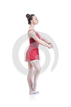 Beautiful artistic female ballerina working out, performing ballet element