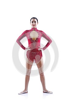 Beautiful artistic female gymnast working out, performing gymnastics element