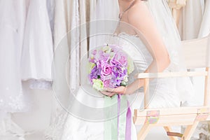 Beautiful Asian bride in wedding dress concept, happy girl hold flowers bouquet dream to her wedding date plan to shopping, woman