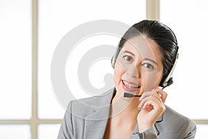 Beautiful asian business customer service woman smiling