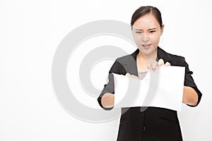 Beautiful Asian business woman wearing black suit. Angry woman tearing up documents and stress on white background and copy space